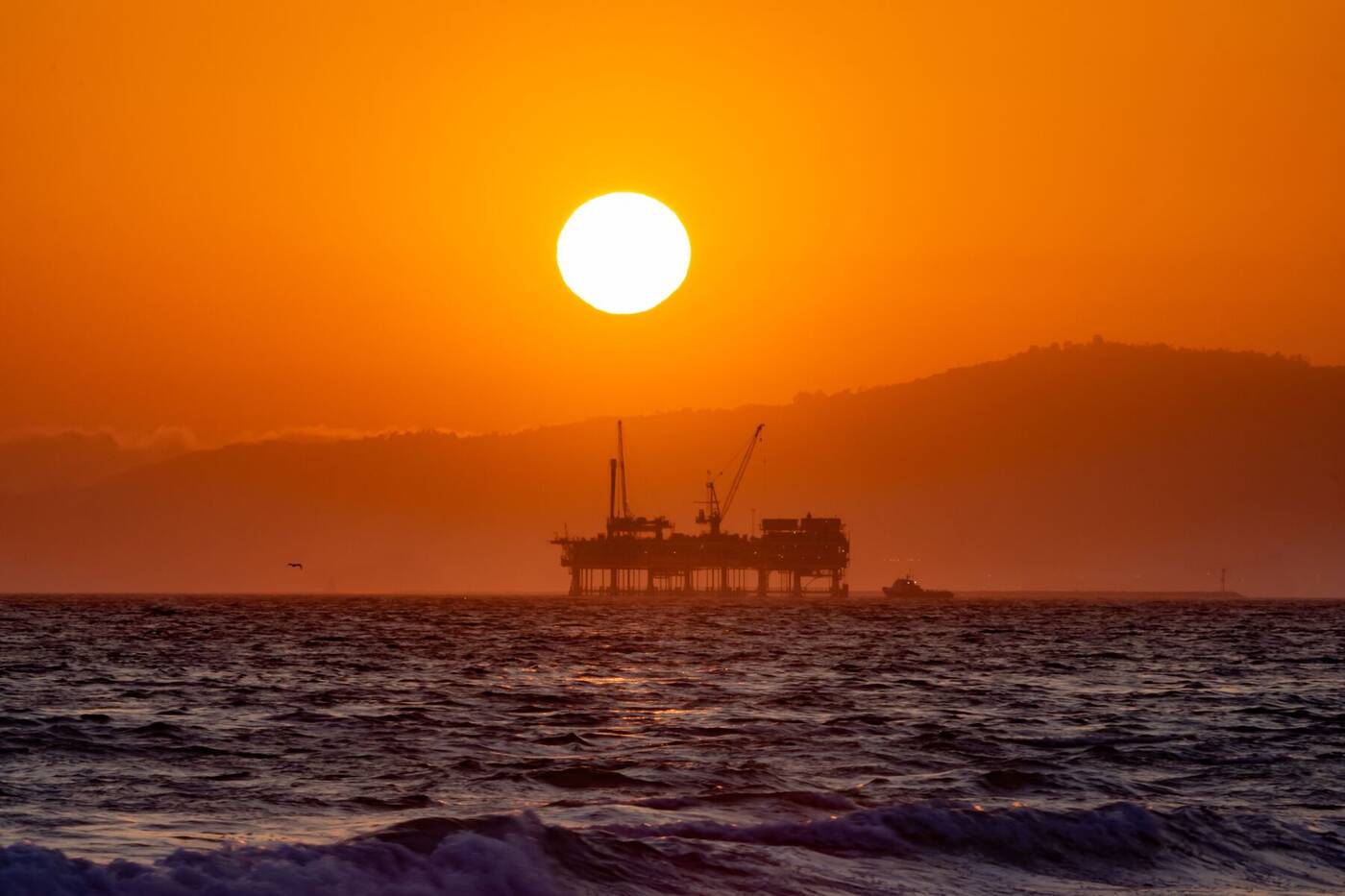Offshore platform silhouette at sunset